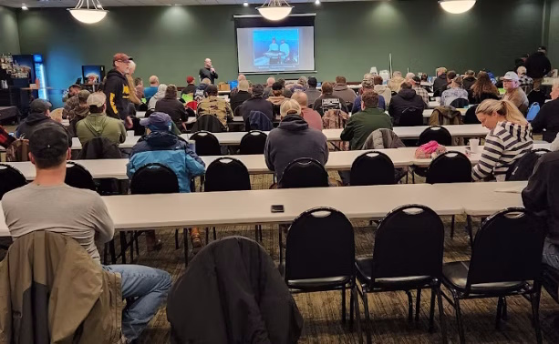 A full room at a monthly membership meeting